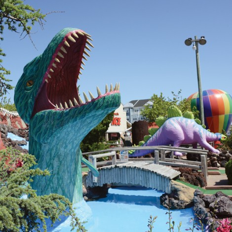 Lost Treasure minture Golf course features large colorful obstacles such as dinosaurs, hot air ballons and greenery